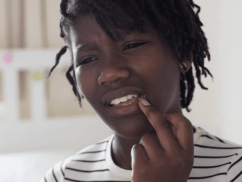 Woman touching her lip